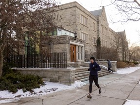 A person jogs on Western University campus on Friday, Jan. 14, 2022. (Mike Hensen/The London Free Press)