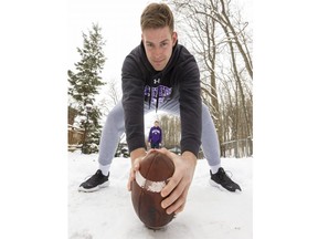 Londoner Zach Zynomirski was signed by the Canadian Football League's Calgary Stampeders. The former Saunders Sabre won two Vanier Cups with the Western Mustangs as a long snapper. His twin brother Jacob stands in the background. (Mike Hensen/The London Free Press)