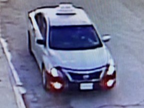 London police say a vehicle believed to be a 2014 Nissan Altima with a fake taxi sign is  being used in a scam that already has netted two suspects $100,000. (London police handout)
