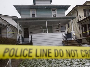 Police tape is used at 924 Elsmere Ave., after a man died of gunshot wounds on March 18, 2017.