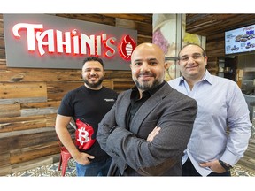 Tahini's restaurant co-owners Aly Hamam, left, Omar Hamam and Ahmed Dessouki have navigated various indoor dining restrictions at their restaurants, and Aly says putting their profits into Bitcoin is helping them as they grow beyond London. (Mike Hensen/The London Free Press)