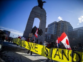 "Freedom Convoy" protesters gather in downtown Ottawa on Sunday, Feb. 13, 2022, on day 17 of the protest. ASHLEY FRASER, POSTMEDIA