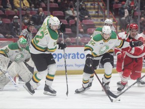 Knights defenceman Jackson Edward battles to clear a loose puck from in front of goalie Brett Brochu between London forward Tye McSorley and Greyhounds forward Ethan Montroy during the first period of their OHL game in Sault Ste. Marie on Friday Feb. 25, 2022. The Greyhounds won, 6-3. Gordon Anderson/Sault Star