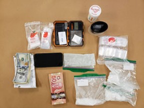 London police seized cocaine, cash and drug paraphernalia during the search of a northwest London home and a vehicle Wednesday night. (Police supplied photo)