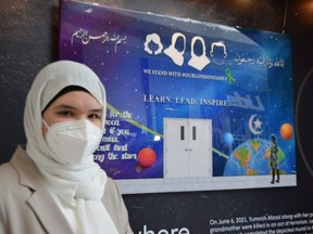 Huda Sallam, a friend of Yumna Afzaal, stands with artwork depicting the slain 15-year-old’s mural at the London Islamic School. Yumna, her parents and grandmother were killed in an alleged hate-motivated attack last June while out for a walk in Hyde Park. The artwork is on display at White Oaks Mall and will be donated to the London Muslim Mosque, (Jennifer Bieman/The London Free Press)