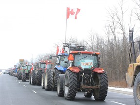 The Ontario Provincial Police have closed the westbound lanes of Highway 402 from Nauvoo Road to Forest Road, between Strathroy and Sarnia, because 20 farm vehicles are parked on the road as part of a protest against COVID-19 mandates. Photo taken on Thursday Feb. 10, 2022. Derek Ruttan/The London Free Press