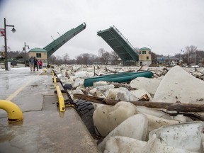 The lift bridge in Port Stanley was closed to vehicle traffic Thursday afternoon as ice in the harbour breaks up. (Derek Ruttan/The London Free Press)
