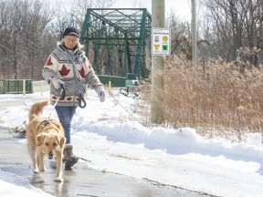 Sally Macrae walks with her dog Molly in east London on Thursday February 24, 2022. City hall is planning to extend the Thames Valley Parkway from the Meadowlilly Road pedestrian bridge to link with City Wide Sports Park and surrounding high-growth areas. (Derek Ruttan/The London Free Press)