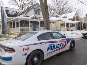 Police were still at 12 Springbank Dr. Tuesday, scene of a fatal stabbing a day earlier. Gregory Cane, 38, of London, has been charged with second-degree murder in the death of Stephen Hutchinson, 66. (Mike Hensen/The London Free Press)
