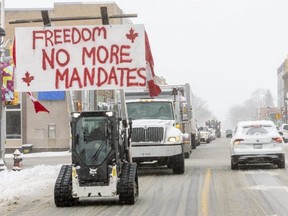 A convoy of vehicles, unofficially estimated at about 200, rolled through Aylmer twice on Thursday Feb. 3, 2022. The protest was made up mainly of pickups and minivans, some adorned with signs that read ‘no more mandates’ and Canadian flags. (Mike Hensen/The London Free Press)