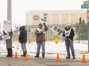 Striking workers at Dr. Oetker picket in front of the plant in southeast London that makes frozen pizzas. About 230 members of Local 175 of the United Food and Commercial Workers union walked off the job early Wednesday after rejecting a final offer from the company. Photo taken Wednesday, Feb. 16, 2022. (Mike Hensen/The London Free Press)