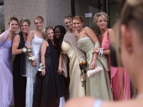 Students celebrating high school graduation are shown in this Postmedia file photo from 2003.