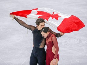 Tessa Virtue and Scott Moir celebrate their gold medal win in the ice dance free program at the 2018 Olympic Winter Games in Pyeongchang, South Korea, on Feb. 20, 2018. (Files)