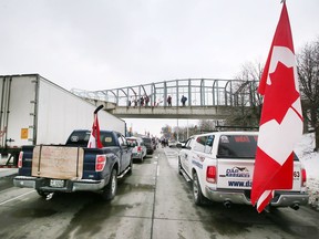 Anti-restriction protestors block southbound lanes of Huron Church Road to the Ambassador Bridge in Windsor on Monday, Feb. 7, 2022.