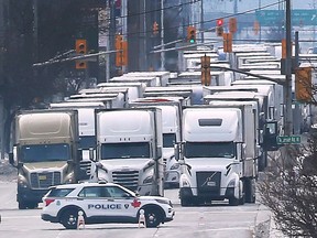 Trucks are shown in the northbound lanes of Huron Church Road in Windsor on Tuesday, February 8, 2022 as anti-government protesters block the flow of traffic near the Ambassador Bridge border crossing at Michigan. (Dan Janisse/Postmedia Network)