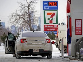 A motorist fills up with gas on February 16, 2022. (LARRY WONG/Postmedia Network)