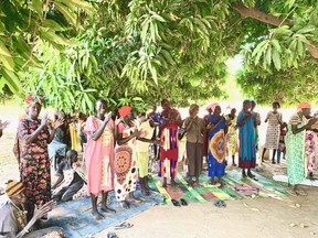 Women come to a church mission at Gordhim, in the Aweil East region of South Sudan, to meet with members of Canadian Aid for South Sudan. The women shared their struggles with recent flooding and requested help from the London-based agency to get clean water. CASS has been operating in the area for 20 years. Glen Pearson photo