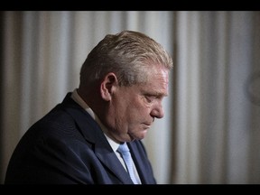 Ontario Premier Doug Ford attends a news conference at the Queens Park Legislature, in Toronto, on Friday, February 11, 2022.