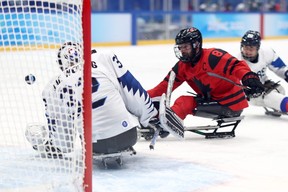 Tyler McGregor of Forest scores against Jae Woong of South Korea in the third period of a para ice hockey semifinal Friday at the Beijing Winter Paralympics. McGregor scored four goals in Canada's 11-0 win. (Ryan Pierse/Getty Images)