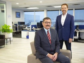 Garry Clement, the new chief anti-money laundering officer at London-based VersaBank, sits in  the bank's London headquarters Monday, March 7, 2022. with David Taylor, the bank's president and chief executive officer.  (Derek Ruttan/The London Free Press)