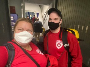 Canadian Medical Assistance Teams executive director Valerie Rzepka, left, and London pediatric nurse Brandon Duncan are shown leaving for Poland on March 4, 2022. The two were the first CMAT representatives on the ground in Ukraine, scoping out where the group could help before more members arrived. (Supplied/CMAT/Instagram)