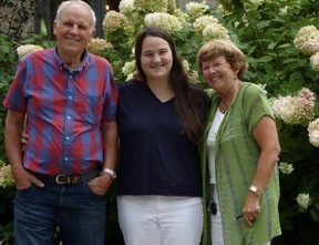 Kristin Legault-Donkers stands between her paternal grandparents, Leo and Joanne Donkers, with whom she lived since age 10 after the death of her mother.  (Submitted photo)