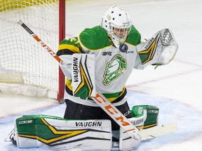 London Knights goalie Owen Flores makes a save against the Windsor Spitfires at Budweiser Gardens in London on Dec. 11, 2021. (Derek Ruttan/The London Free Press)