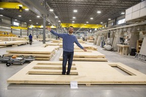 Chris Latour, vice president of operations at Element5, stands inside a window cut-out for a wall made with laminated mass timber at the company's plant in St. Thomas.  (Derek Ruttan/The London Free Press)