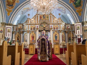 Father Jaorslaw Buciora offers mass during Sunday morning service at the Ukrainian Orthodox Church of the Holy Trinity in London on March 13, 2022. Derek Ruttan/The London Free Press