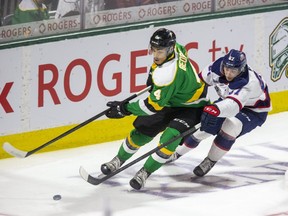 Nick Wong of the Saginaw Spirit chases Isaiah George of the London Knights in a game March 14, 2022, at Budweiser Gardens in London. George and his Knights teammate Ruslan Gazizov are playing in the Top Prospects Game Wednesday night in Kitchener. (Derek Ruttan/The London Free Press)