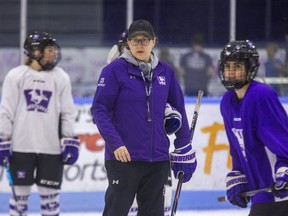 Western University women's hockey coach Candice Moxley oversees a practice at Thompson Arena in London on Tuesday March 15, 2022. Moxley is juggling coaching duties and caring for her one-month-old son as the Mustangs prepare to play Brock in the OUA West final on Wednesday. (Derek Ruttan/The London Free Press)