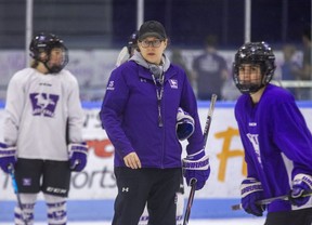 Western University women's hockey coach Candice Moxley oversees a practice at Thompson Arena in London on Tuesday March 15, 2022. Moxley is juggling coaching duties and caring for her one-month-old son as the Mustangs prepare to play Brock in the OUA West final on Wednesday. (Derek Ruttan/The London Free Press)