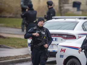 London police officers investigate a shooting on Egerton Street on Wednesday, March 30, 2022. Police said a 59-year-old man suffered serious injuries, and a 73-year-old man is charged with aggravated assault and firearm charges. (Derek Ruttan/The London Free Press)