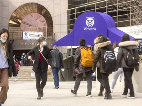 Western University students walk on campus. Applications to Western and its affiliate colleges from Ontario high school students fell this spring compared to last year. Photograph taken Wednesday, March 1, 2022. (Mike Hensen/The London Free Press)