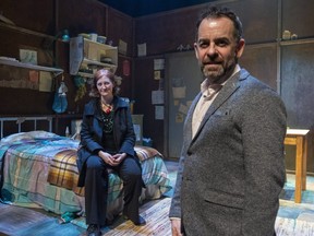 Author and playwright Emma Donoghue, left, and the Grand Theatre's artistic director Dennis Garnhum pose on the set of Room on March 8, 2022. (Mike Hensen/The London Free Press)