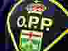 Close up of an OPP badge.