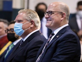 Ontario Premier Doug Ford, left, and Windsor Mayor Drew Dilkens attend a news conference on Wednesday, March 23, 2022, in Windsor where an investment of up to $4.9 billion to build an electric vehicle battery plant in the city was announced. (Dan Janisse/Postmedia Network)