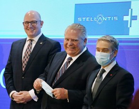 Windsor Mayor Drew Dilkens, left, Ontario Premier Doug Ford and Federal Minister of Economic Development, Job Creation and Trade François-Philippe Champagne are shown at a news conference on Wednesday, March 23, 2022, in Windsor where a $5-billion dollar investment to build an EV battery plant in the city was announced. (Dan Janisse/Postmedia Network)