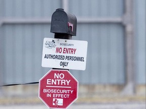 A sign at the entrance to a turkey farm on Oxford County in 2015 notifies visitors of enhanced biosecurity measures following an outbreak of bird flu. A new strain of bird flu has been found at three southern Ontario farms, including one near Thamesford. (File photo)