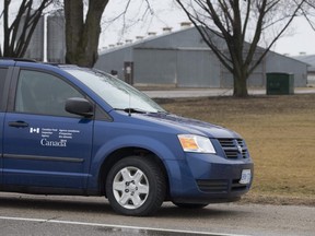 A Canada Food Inspection Agency vehicle sits outside of a turkey farm on Highway 2 following a bird flu outbreak in 2015. Outbreaks of the H5N1 strain of bird flu have been declared at two farms in southern Ontario, including one in the Thamesford area. (London Free Press file photo)
