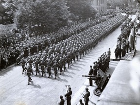 Canadian troops are shown being led into Dieppe on Sept. 1, 1944.