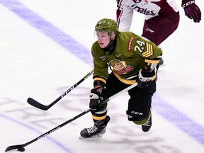 Ty Nelson of the North Bay Battalion carries the puck away. Sean Ryan Photo