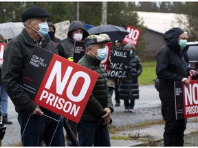North Grenville residents carry 'No Prison' signs while they protest at the site of a proposed correctional facility on Kemptville Campus land last November. Decisions are coming soon from the Ontario government — but so is an election.