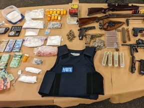 London police seized suspected fentanyl, cocaine, methamphetamine and other drugs worth an estimated $257,000 from a Waterloo Street home Thursday. Multiple guns were also seized during the search that led to charges against two men and a woman. (London police photo)
