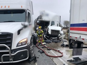 A London resident, 22, is charged with careless driving following a crash Monday on Highway 401 involving multiple transport trucks. One person was injured, police said. (OPP supplied photo)