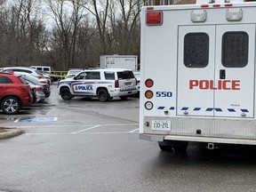 London police investigate after a female pedestrian was struck and killed Monday, April 11, 2022, in a parking lot of a student rental building at 974 Western Rd. MIKE HENSEN, The London Free Press