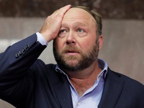 Alex Jones of Infowars talks to the media while visiting the U.S. Senate's Dirksen Senate office building as Twitter CEO Jack Dorsey testifies before a Senate Intelligence Committee hearing on Capitol Hill in Washington, U.S., September 5, 2018.  Picture taken September 5, 2018. (REUTERS/Jim Bourg/File Photo)