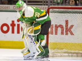 Goalie Brett Brochu seems to be in pain after an awkward first-period fall as he returned from a lengthy injury absence to start Game 1 against the Kitchener Rangers on Thursday April 21, 2022 at Budweiser Gardens. He played the whole game, which London lost 3-2. Mike Hensen/The London Free Press