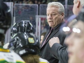 London Knights head coach Dale Hunter is shown behind the bench on Friday, April 22, 2022, during Game 2 of their playoff series against the Kitchener Rangers at Budweiser Gardens in London. (Mike Hensen/The London Free Press)