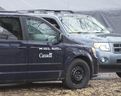 Canada Food Inspection Agency vehicles sit outside of a turkey farm on Highway 2 in Oxford County following an outbreak of bird flu in 2015. (London Free Press file photo)